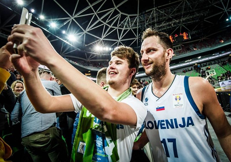 Slovenia's Sasa Zagorac (17) taking a selfie with a fan after their 87-74 win over Belrus.